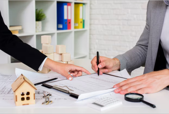 A woman signing a document