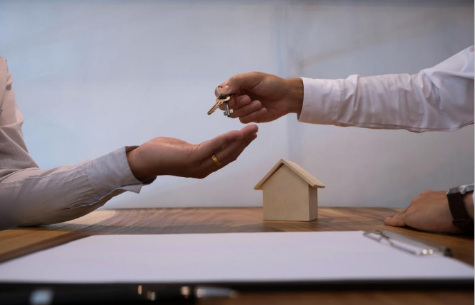 Renter giving house keys to the landlord after losing eviction claim