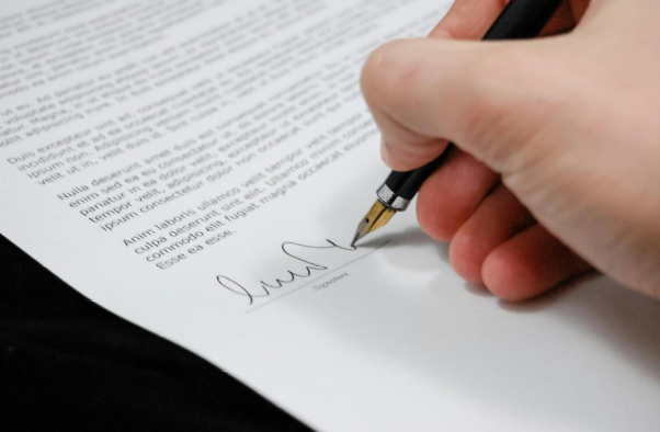 A person signing a contract