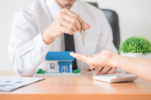 A landlord taking keys from a tenant