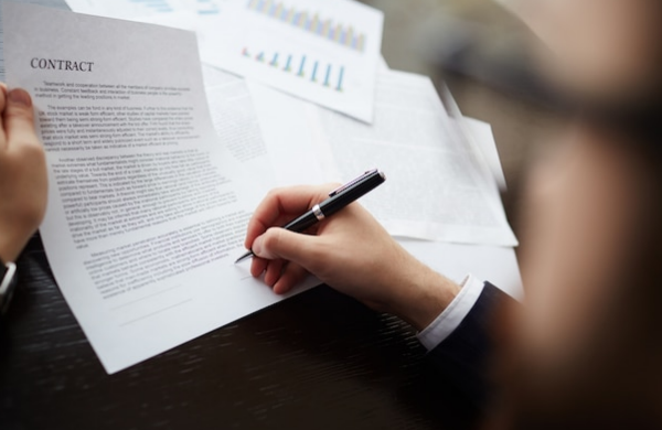 A person signing a contract