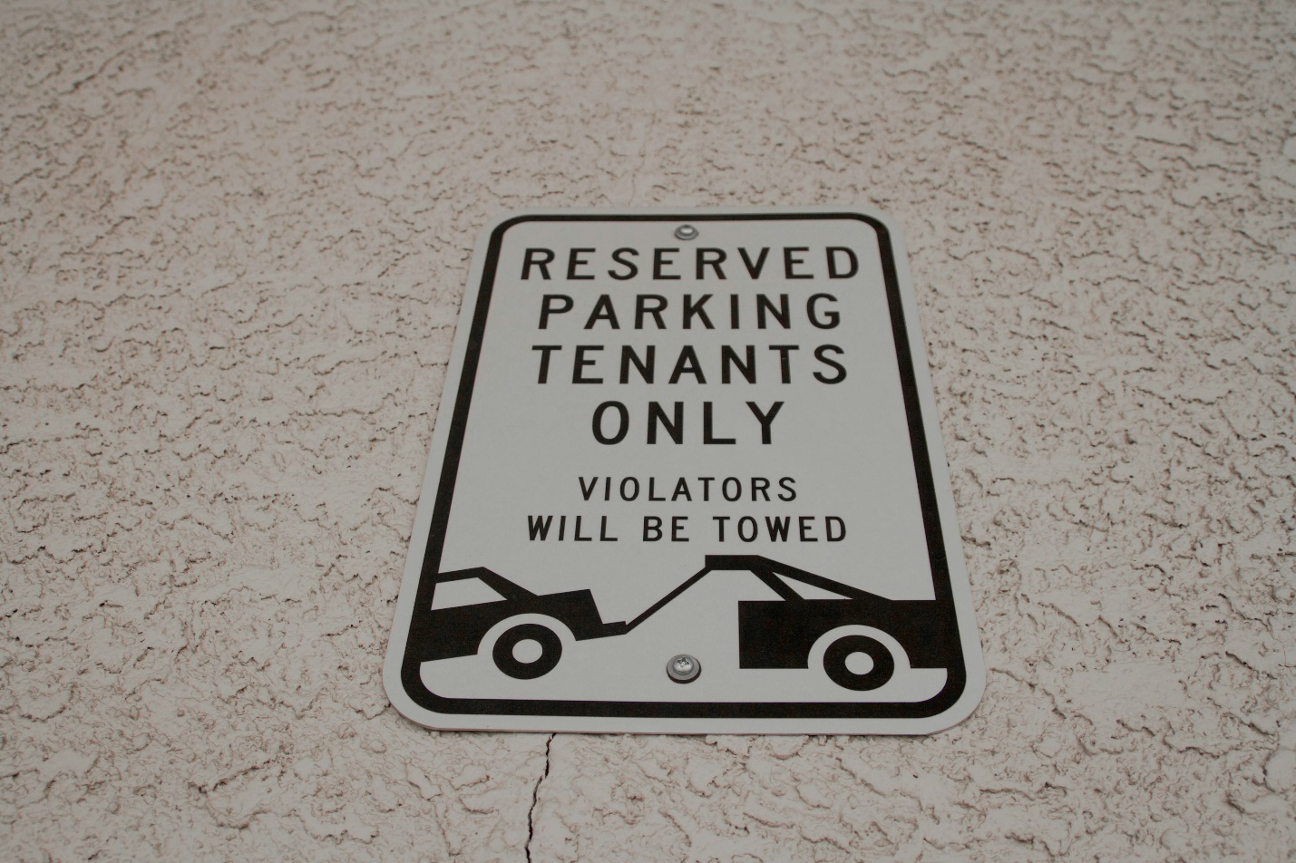 Reserved parking sign for tenant rights protection