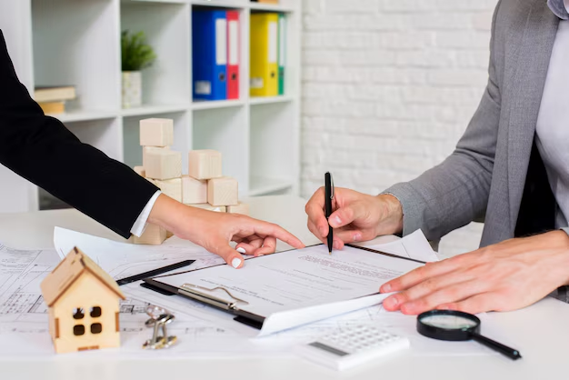 A woman signing a document